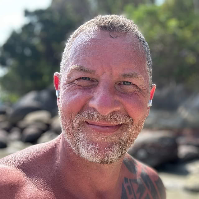 Dax Moy smiling outdoors